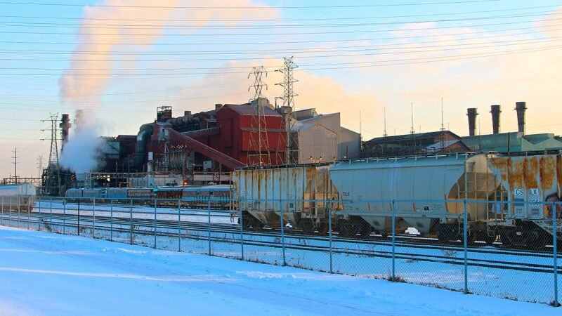 A steel plant on the Cuyahoga River in Cleveland, Ohio, with rail cars in the foreground