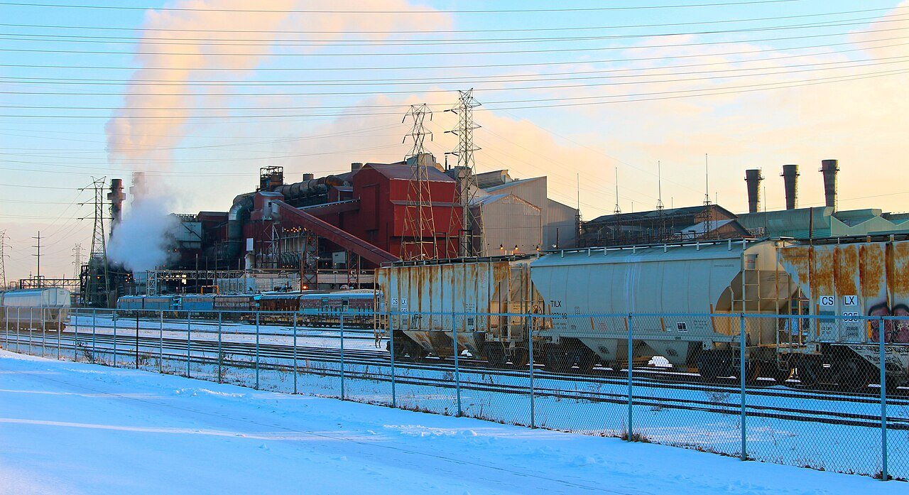A steel plant on the Cuyahoga River in Cleveland, Ohio, with rail cars in the foreground