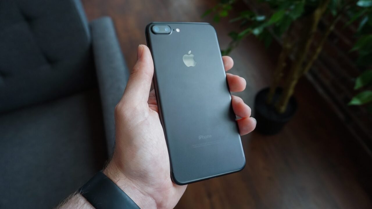 hand holding black smartphone social media mobile