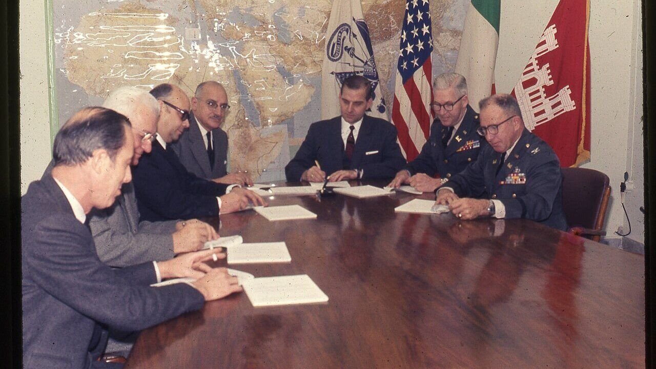 Illustrative photo: 541 Cameron reviewing contract documents - USACE-p15141coll5-15675 (Wikimedia Commons, Public domain)