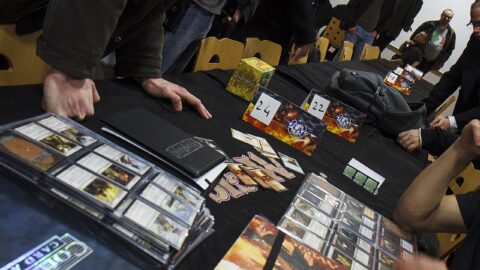 Players trading Magic: The Gathering cards at a gaming event
