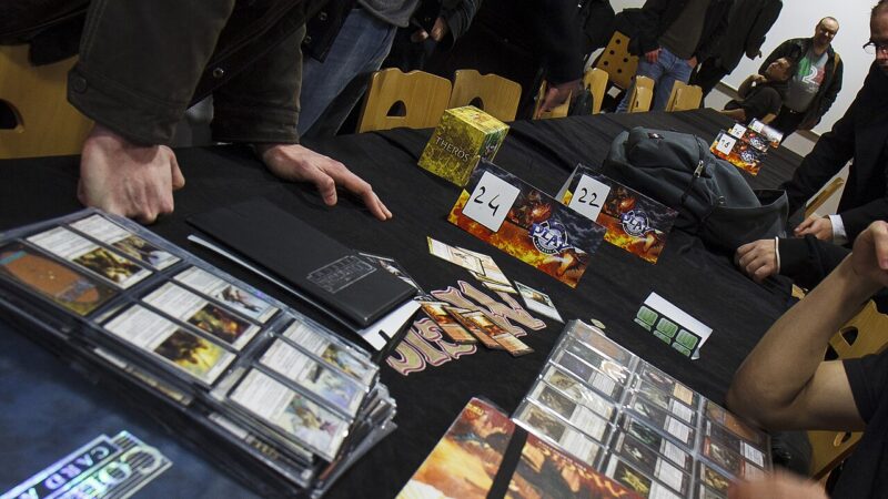 Players trading Magic: The Gathering cards at a gaming event