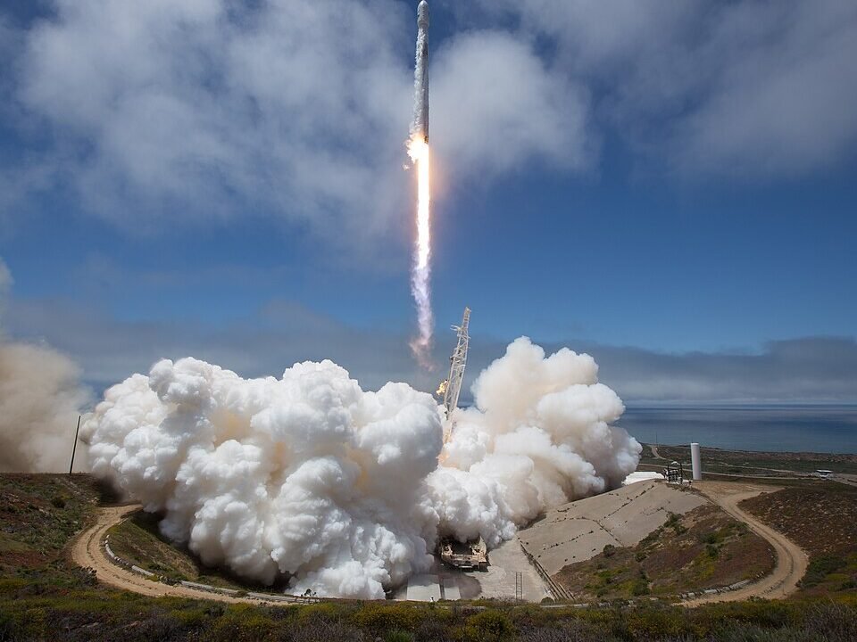SpaceX Falcon 9 rocket lifting off with satellites aboard